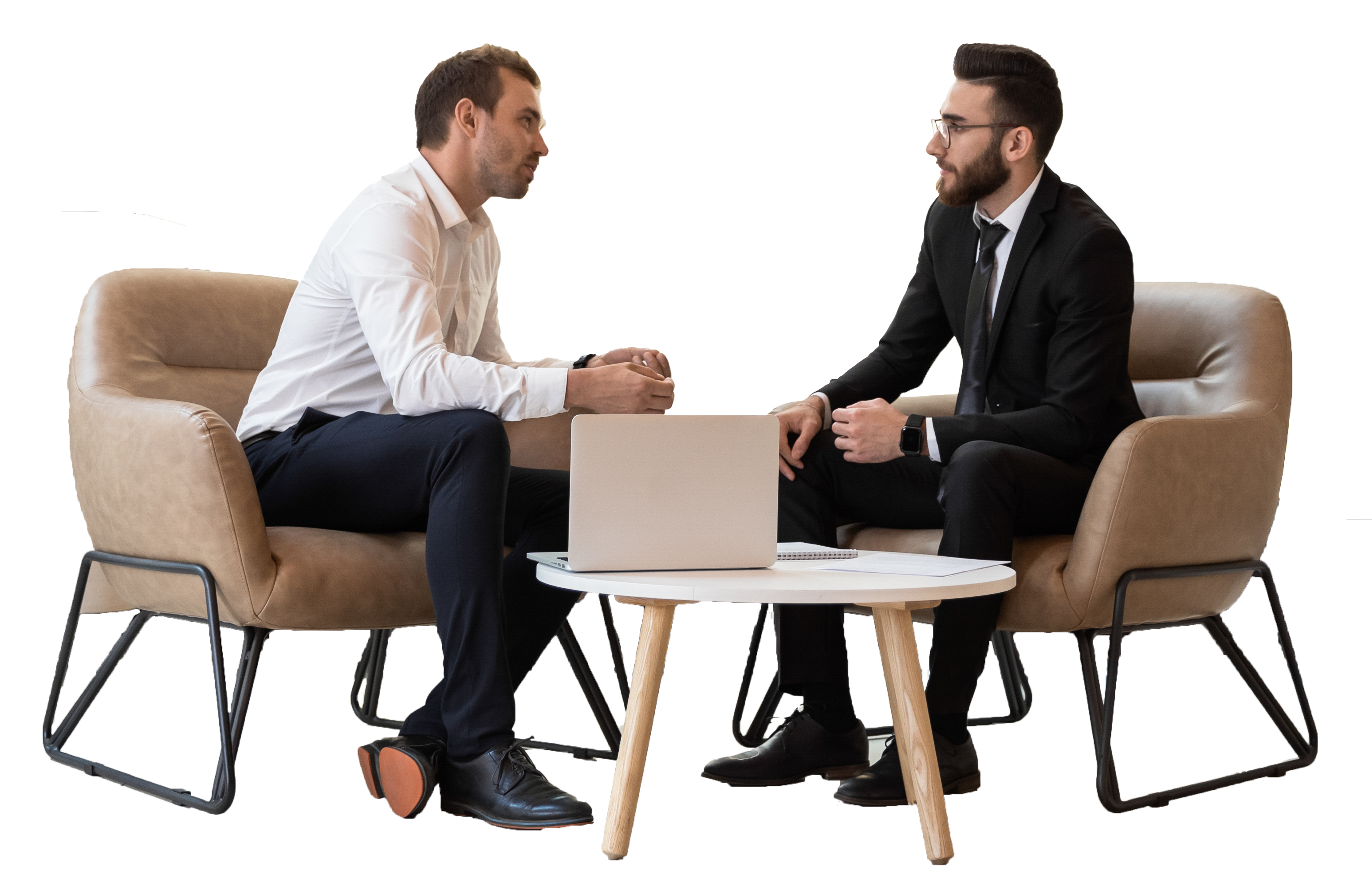 Two men sitting together at a coffee table, one-on-one coaching.