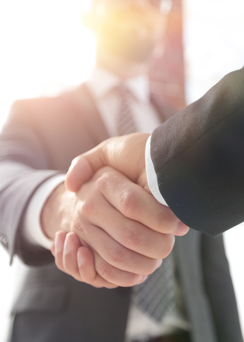 Closeup handshake between two people - field tech and customer Closeup of a handshake between businessmen.